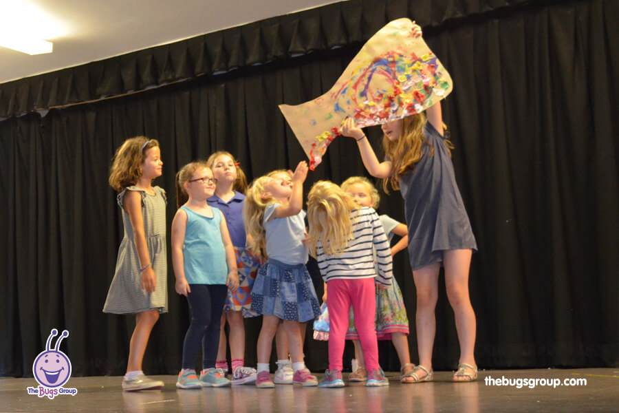 young girls performing in a stage show at dance bugs holiday camp