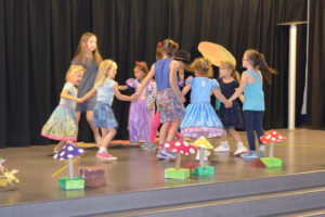 children dancing onstage at a dancebugs camp