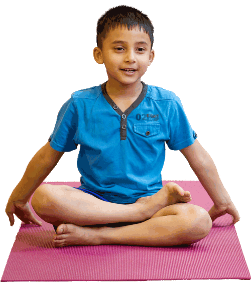 a young boy sat cross legged in a yoga pose