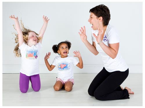 a yogabugs coach and two children enjoying a session