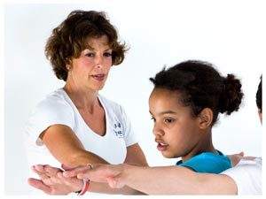 a yogabugs teacher watching over a pupil