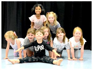 kids at dance camp posing for the camera